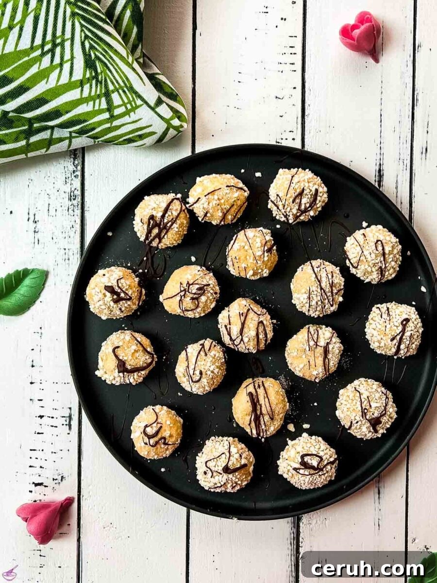 Eggnog Mascarpone Cookies: Christmas Spice Cookie Recipe 2 Gorgeous mascarpone eggnog cookies, rolled in ladyfinger crumbs and drizzled with chocolate sauce.