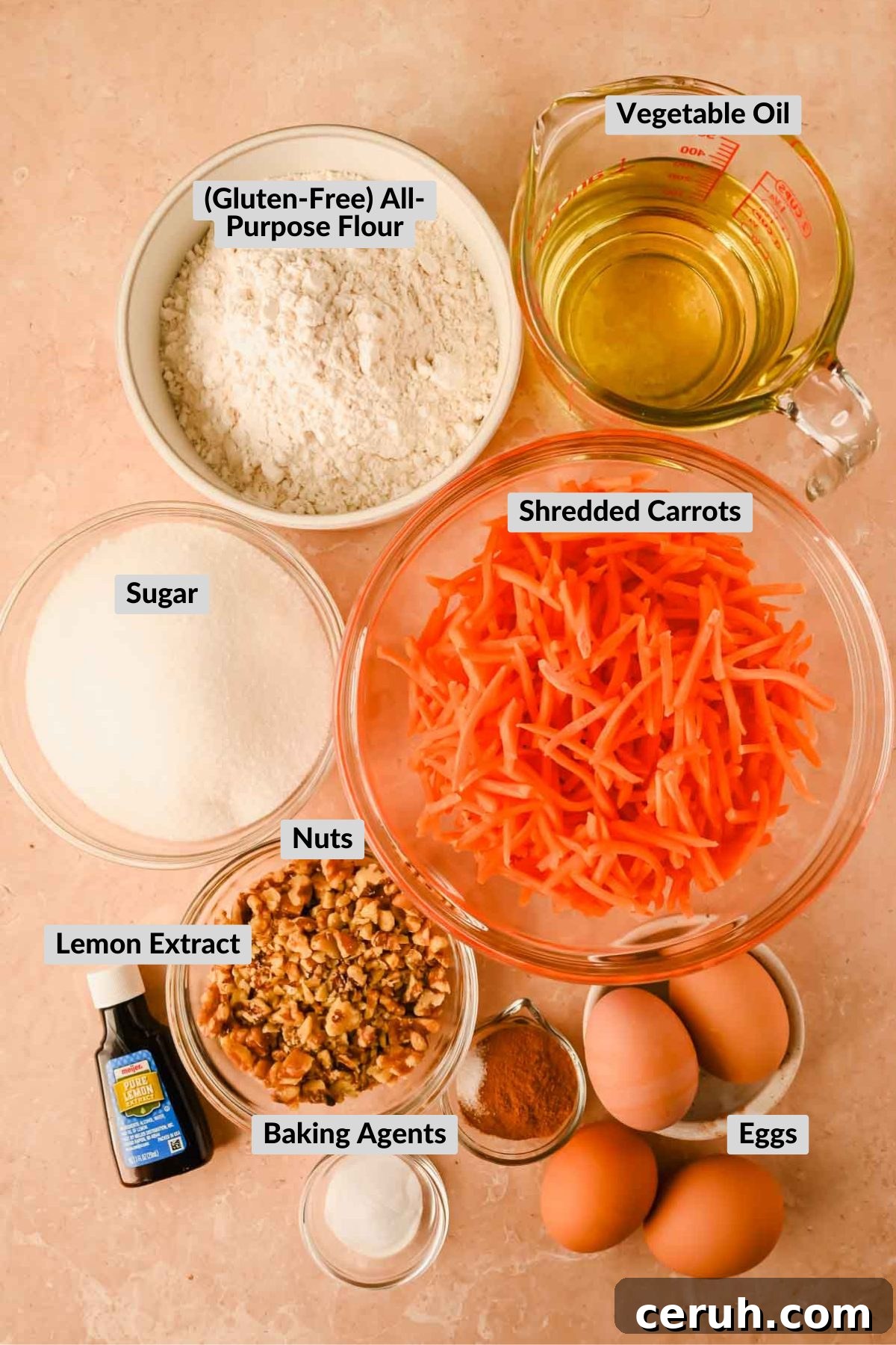 carrot cake ingredients in separate bowls on orange background. 