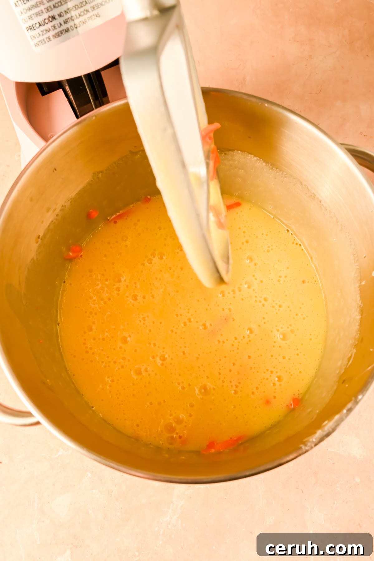 wet ingredients and shredded carrots mixed together in stand mixer.