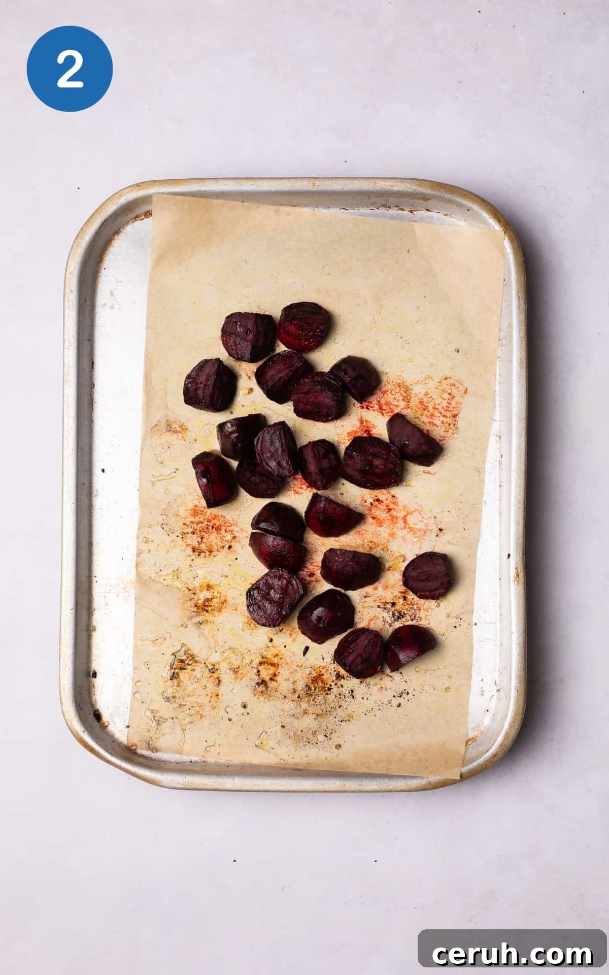 beetroot cubes on a lined baking tray.