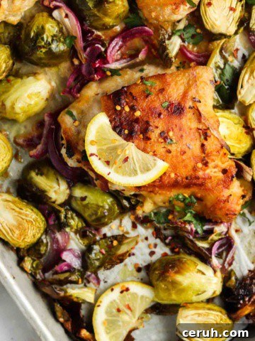 cooked chicken thighs on a sheet pan