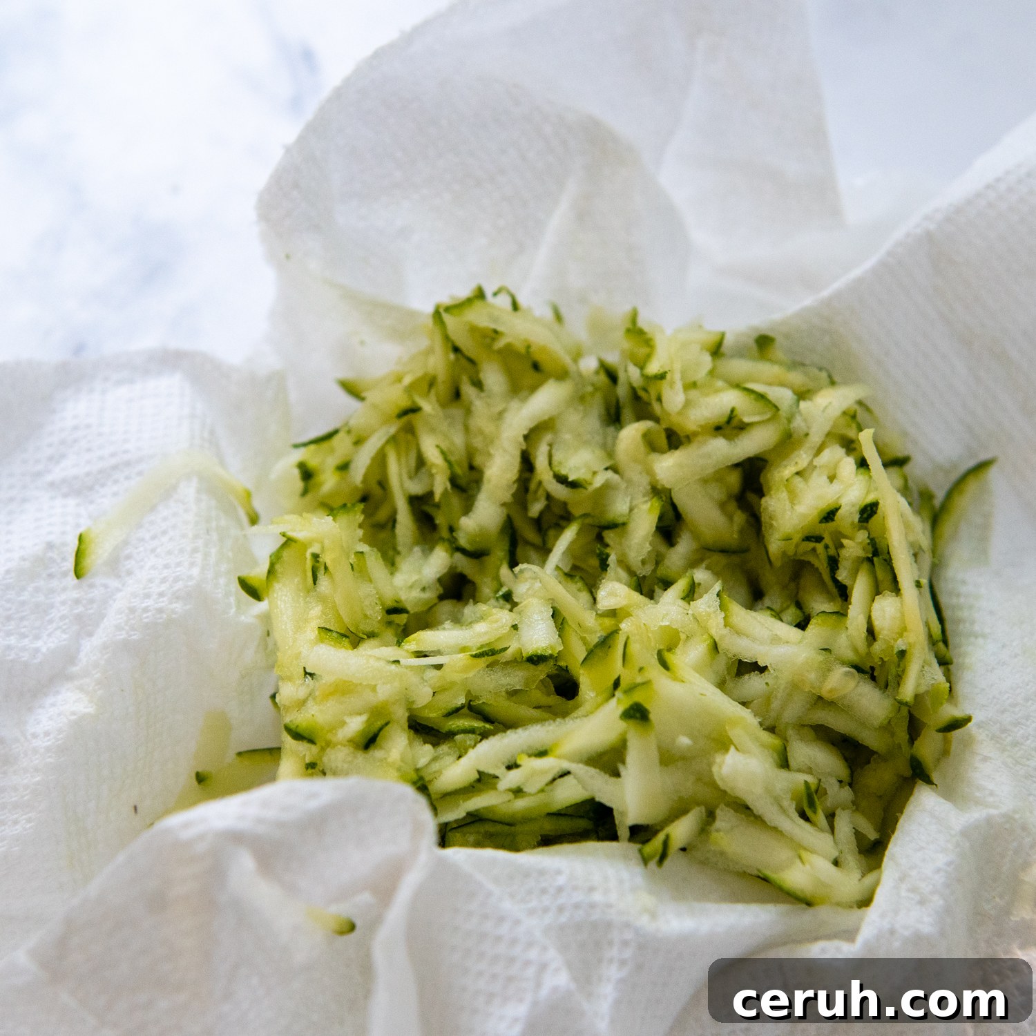 Soft Chewy Gluten-Free Zucchini Cookies That Stay Moist 3 paper towels blotted in zucchini.