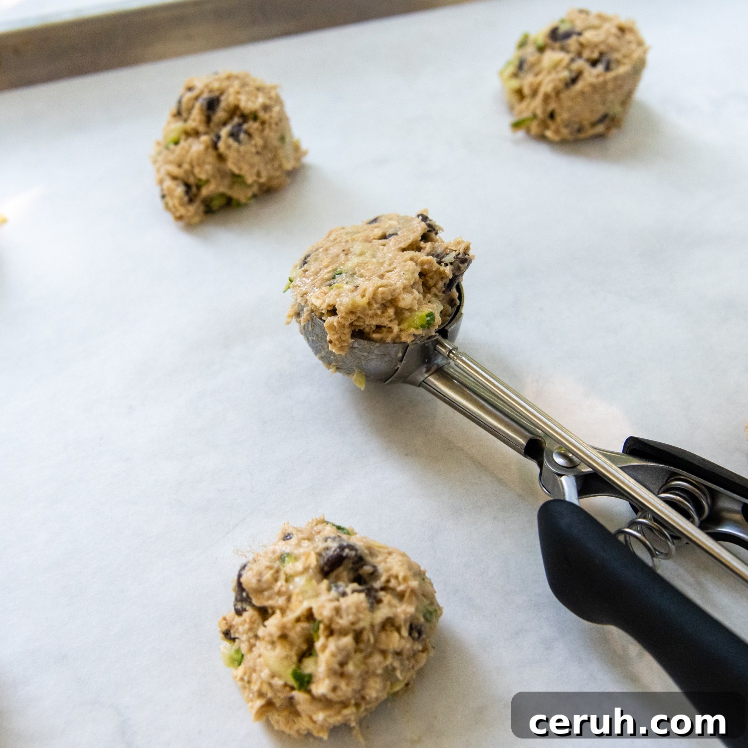 Soft Chewy Gluten-Free Zucchini Cookies That Stay Moist 7 a cookie scoop portioning out dough.