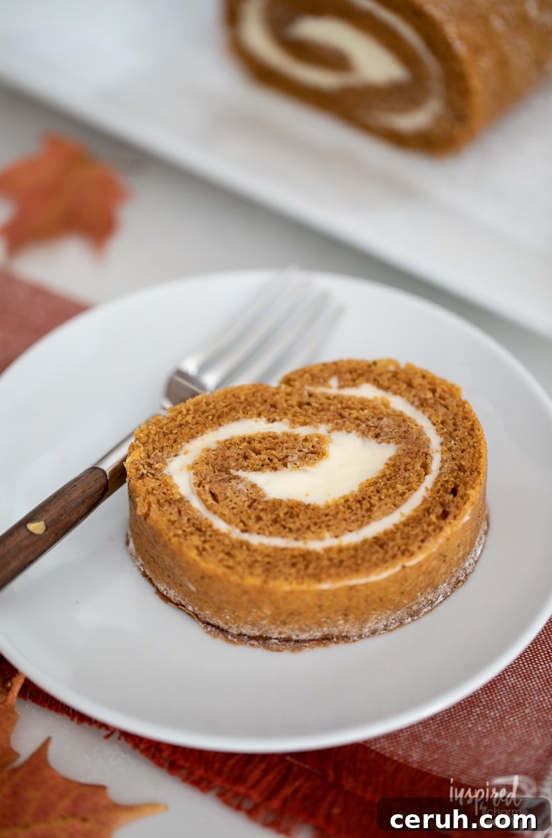 slice of pumpkin roll served on a plate.