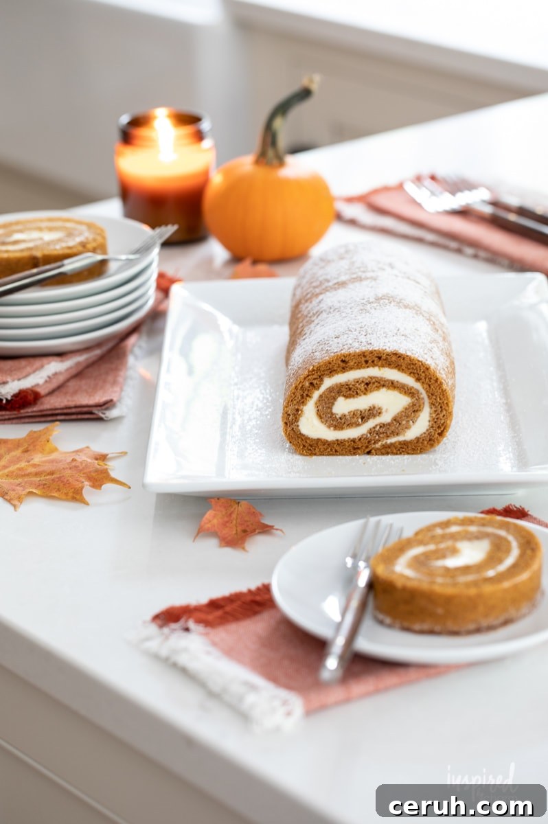 pumpkin roll served on a white platter.