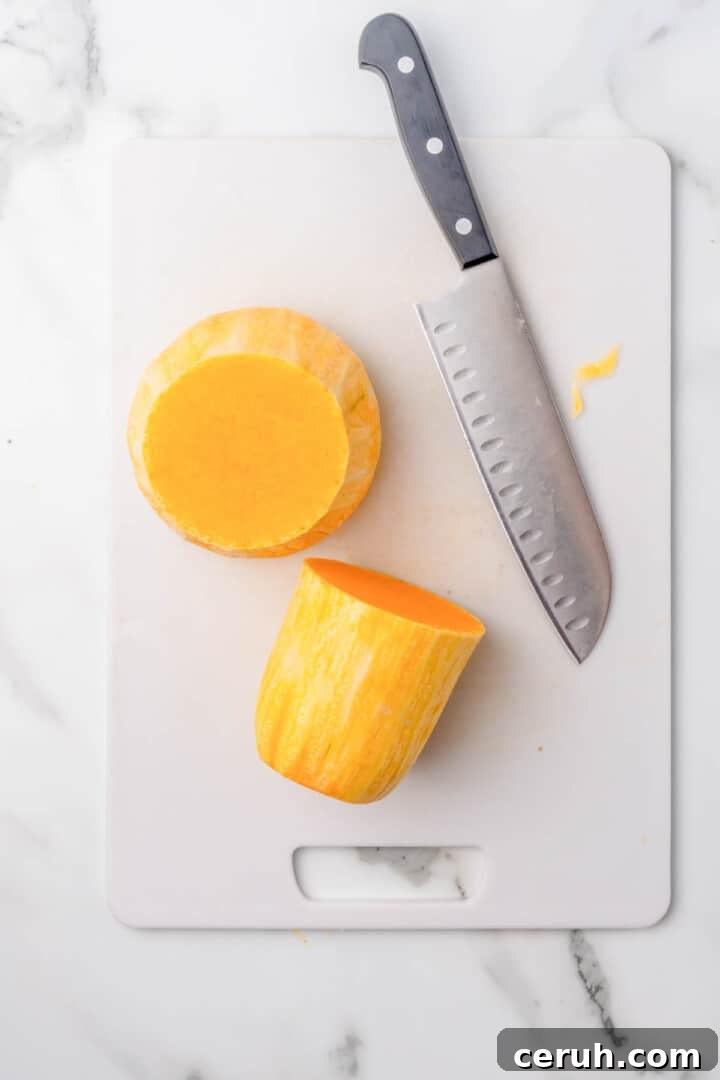 cutting the butternut squash in half.