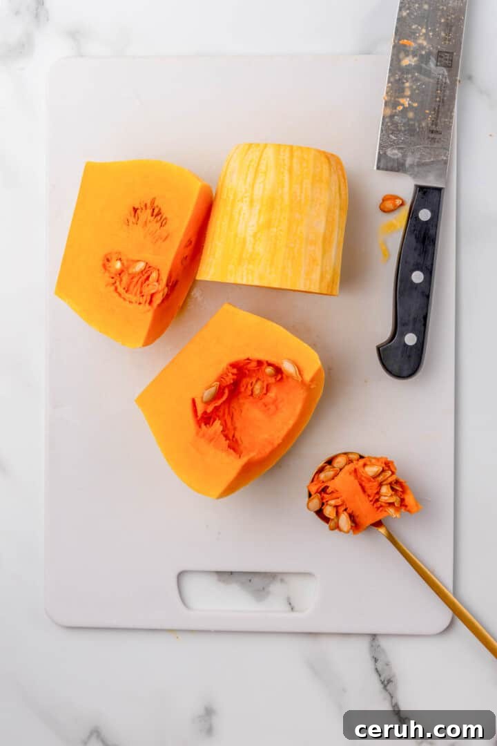 taking the seeds out of the butternut squash.