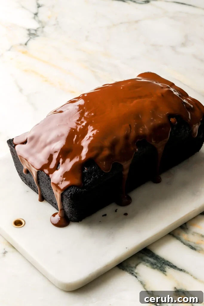 chocolate ganache spread on top of loaf cake