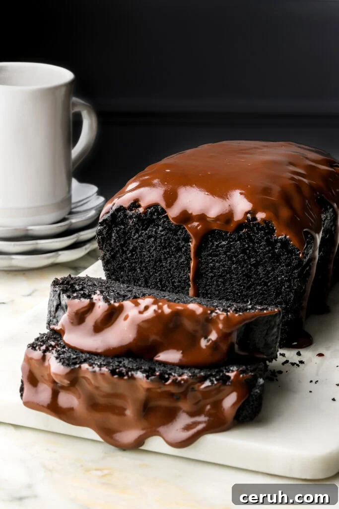 black cocoa loaf cake with chocolate ganache dripping