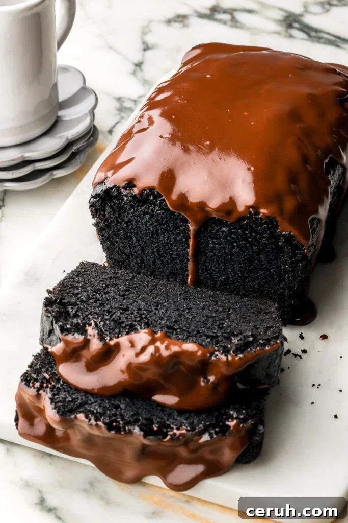 black cocoa loaf cake with chocolate ganache dripping