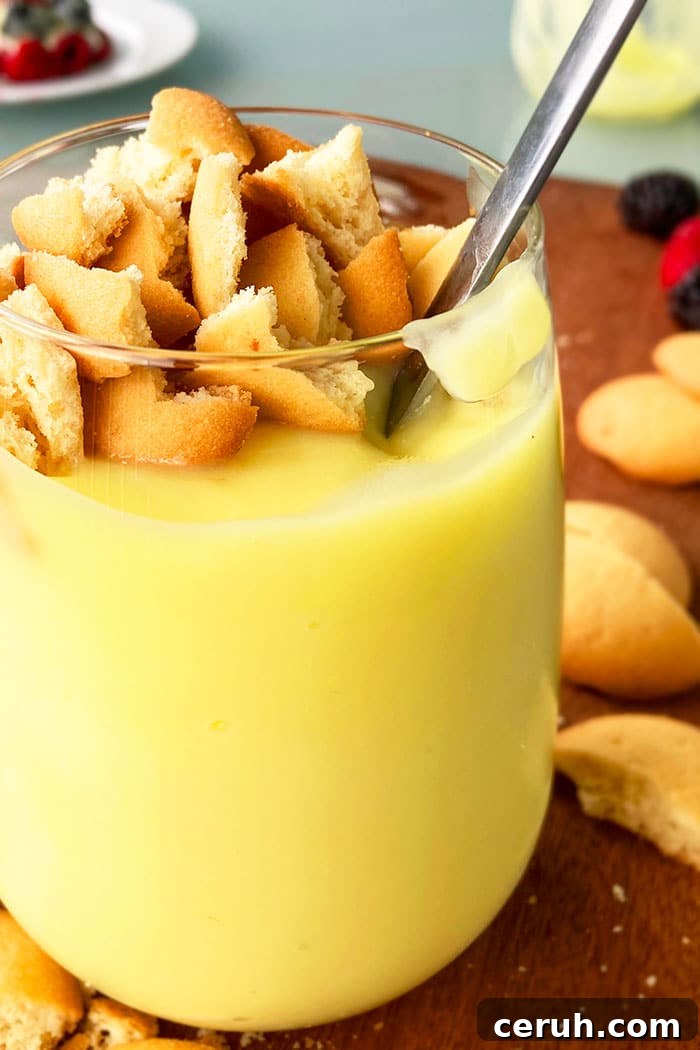 Easy Banana Pudding From Scratch in Glass Cup With Silver Spoon