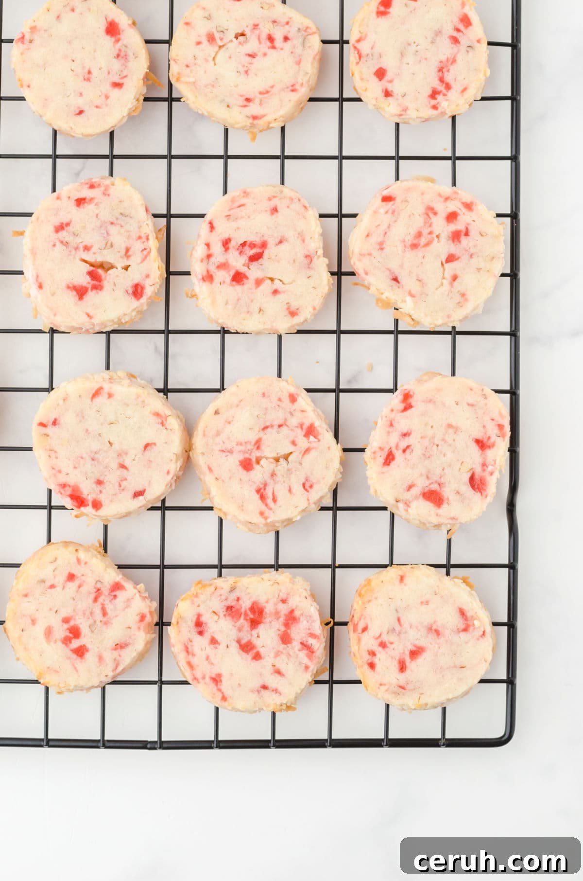 Overhead view of cookies cooling on a rack.