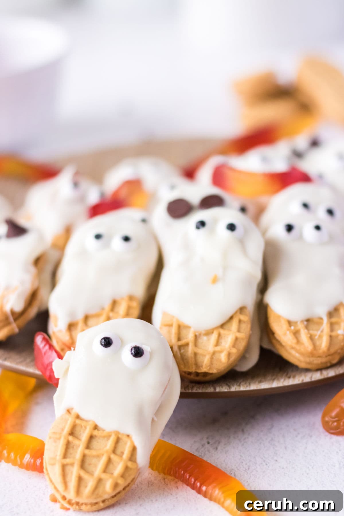 Finished Nutter Butter ghosts on a plate.