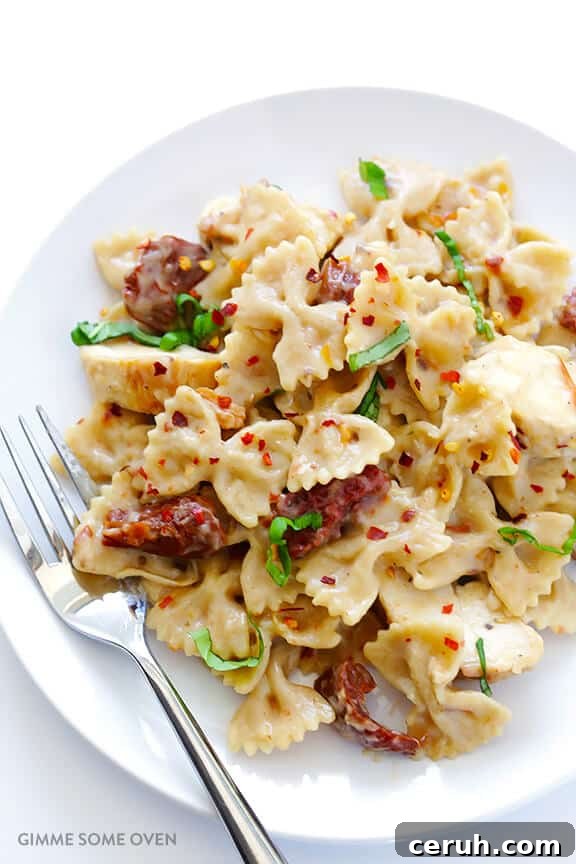 Creamy Chicken Pasta with Sun-Dried Tomatoes and Garlic 3 Creamy Pasta with Chicken & Sun-Dried Tomatoes -- ready to go in 30, and made with a lightened-up sauce | gimmesomeoven.com