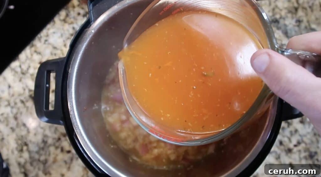 Instant Pot Linguine alla Parma: Creamy Prosciutto & Parmesan 13 Pouring broth in pot
