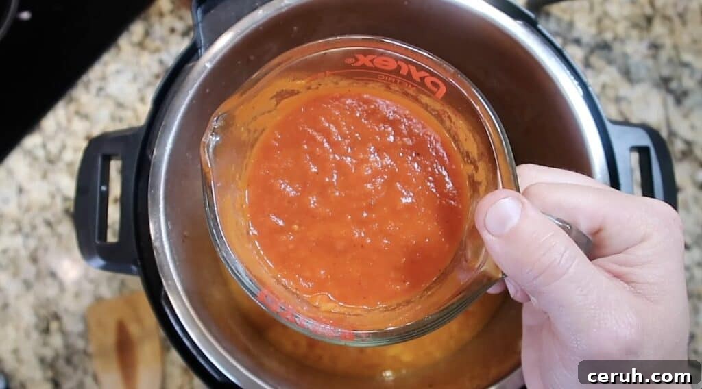Instant Pot Linguine alla Parma: Creamy Prosciutto & Parmesan 17 Adding marinara sauce to pot