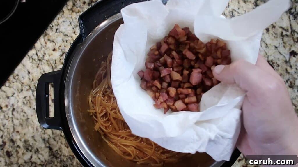 Instant Pot Linguine alla Parma: Creamy Prosciutto & Parmesan 23 Returning pancetta to pot