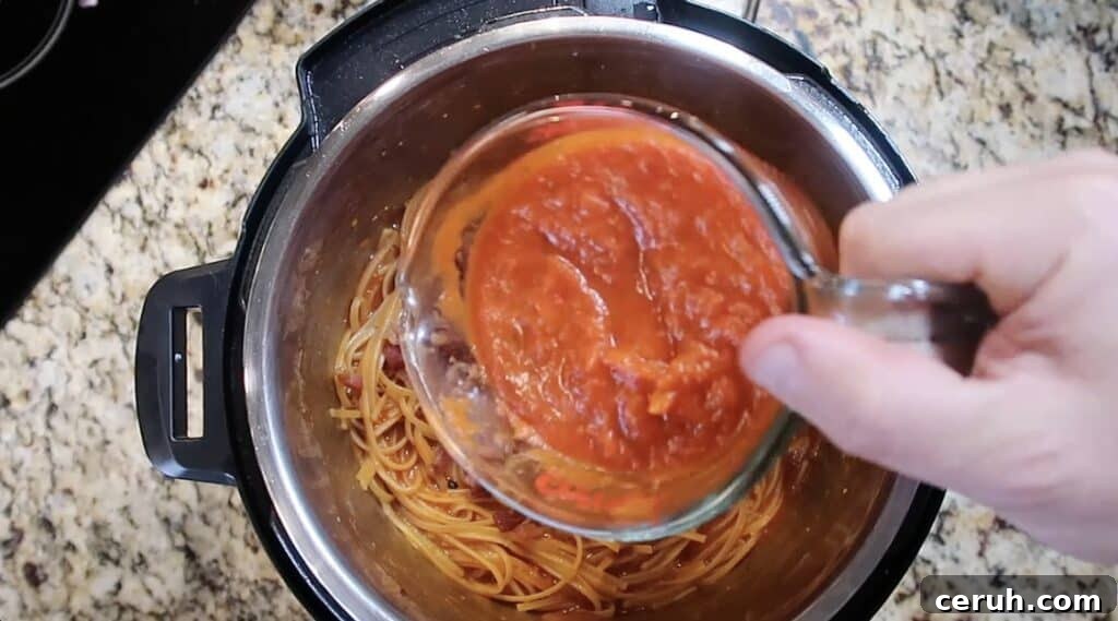 Instant Pot Linguine alla Parma: Creamy Prosciutto & Parmesan 24 Adding more marinara to pot