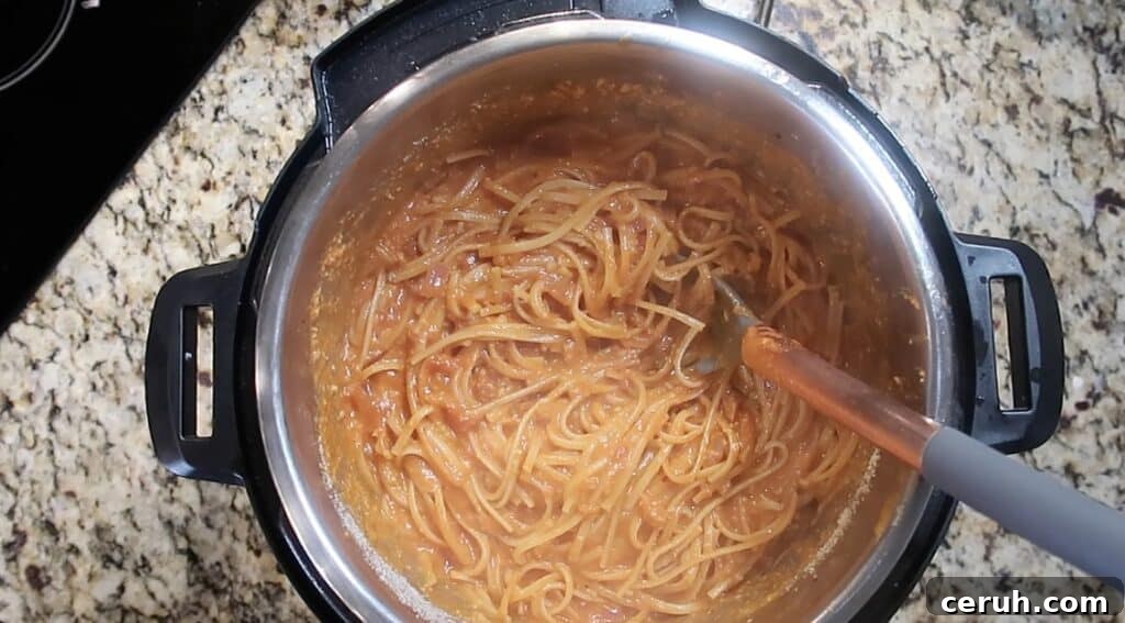 Instant Pot Linguine alla Parma: Creamy Prosciutto & Parmesan 27 Stirring pot and letting pasta rest.