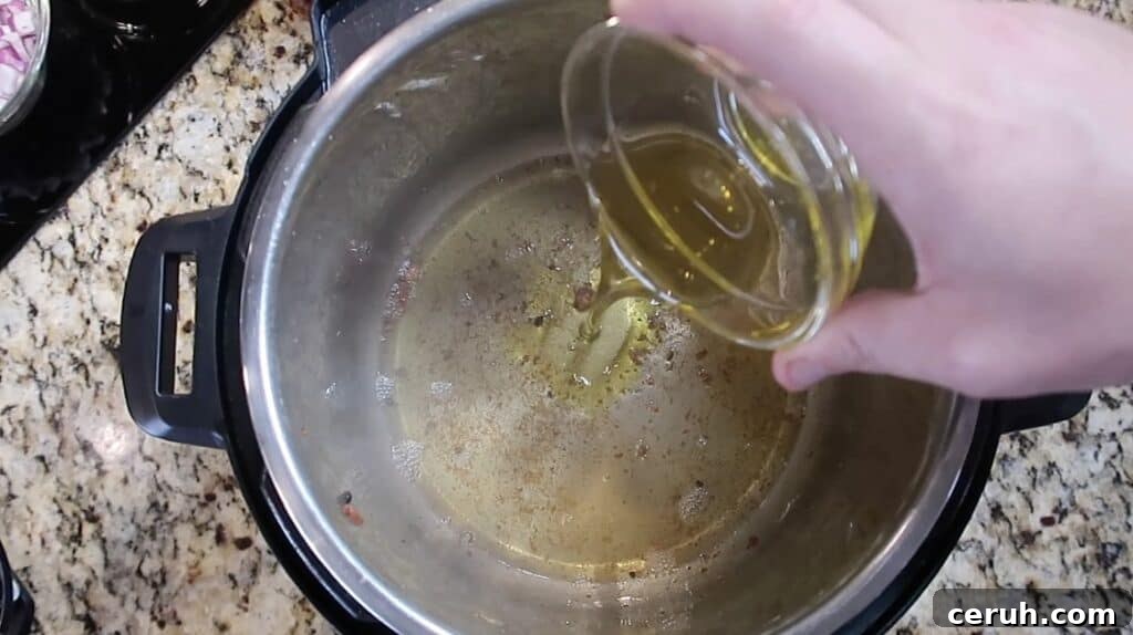 Instant Pot Linguine alla Parma: Creamy Prosciutto & Parmesan 9 Adding olive oil to pot