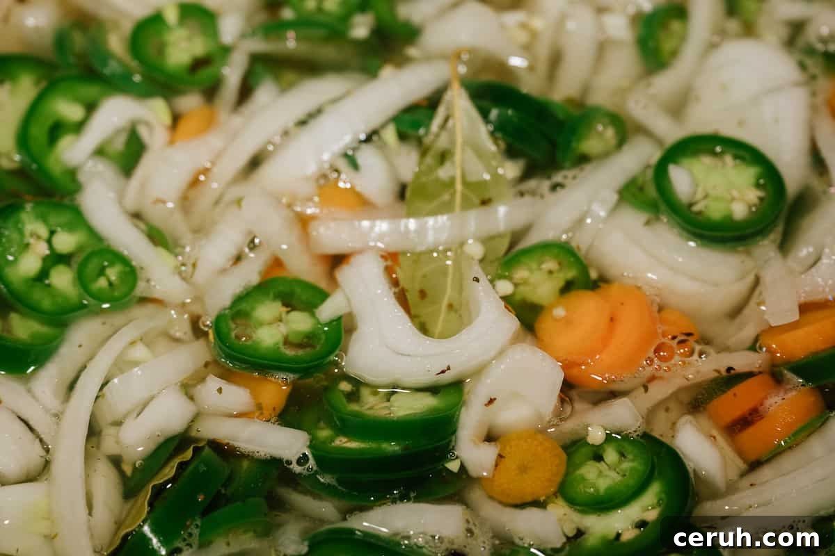 Mexican pickled jalapeños and carrots closeup.