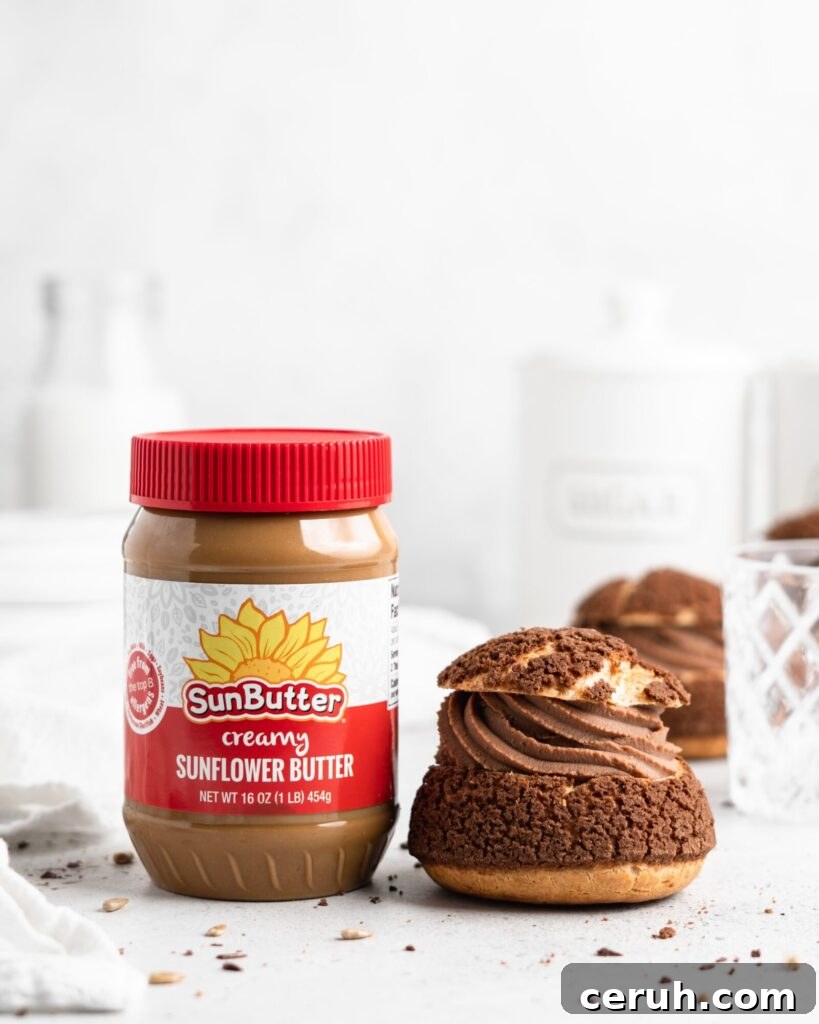 Cream puffs topped with a chocolate craquelin, filled with a creamy SunButter Milk Chocolate whipped ganache filling