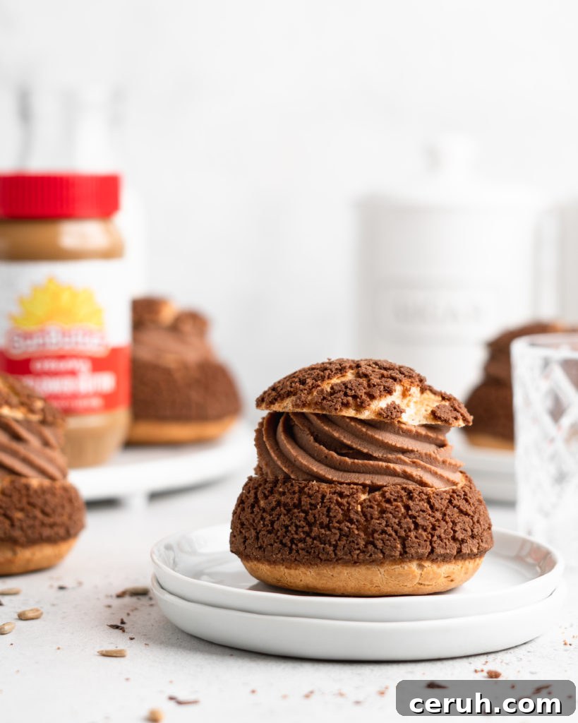 Cream puffs topped with a chocolate craquelin, filled with a creamy SunButter Milk Chocolate whipped ganache filling