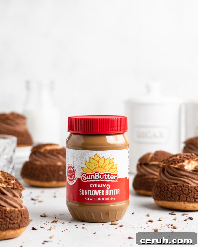 Cream puffs topped with a chocolate craquelin, filled with a creamy SunButter Milk Chocolate whipped ganache filling