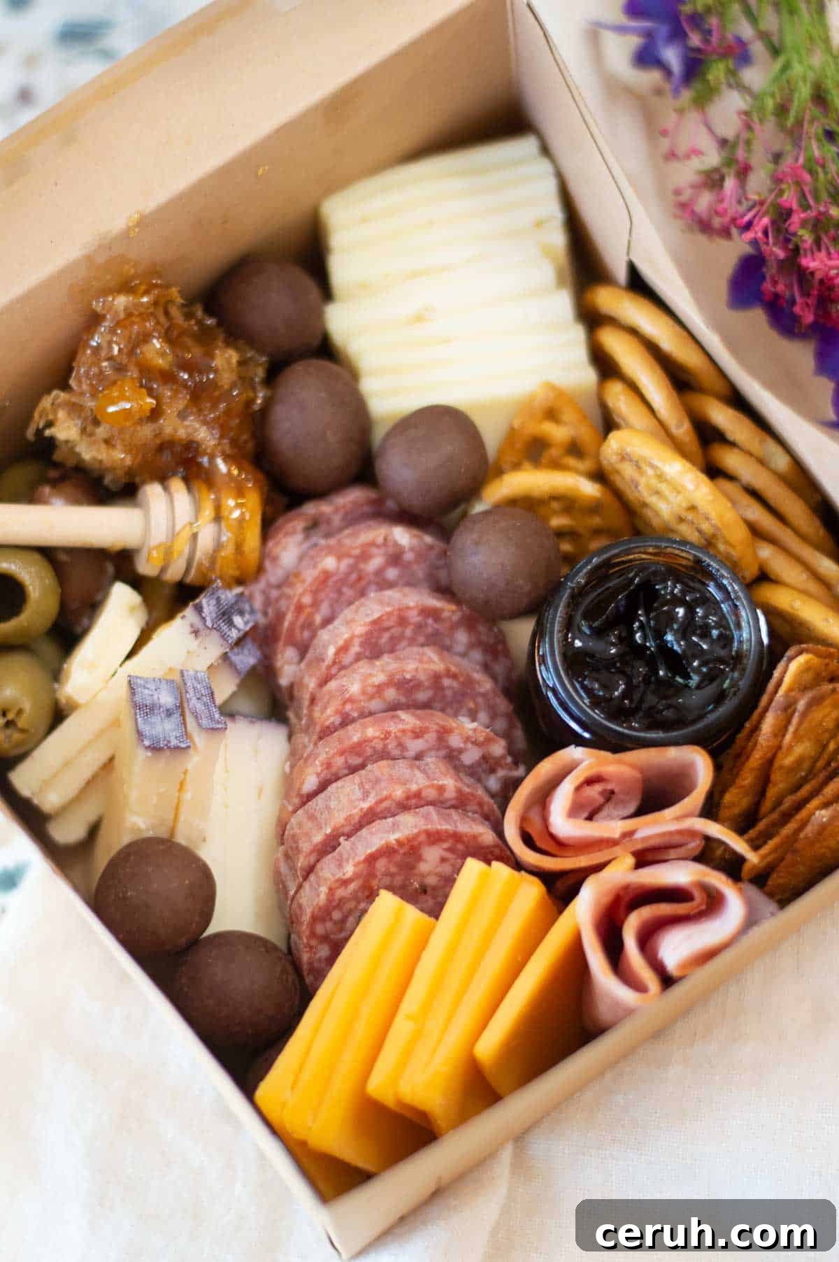 individual charcuterie box with honey