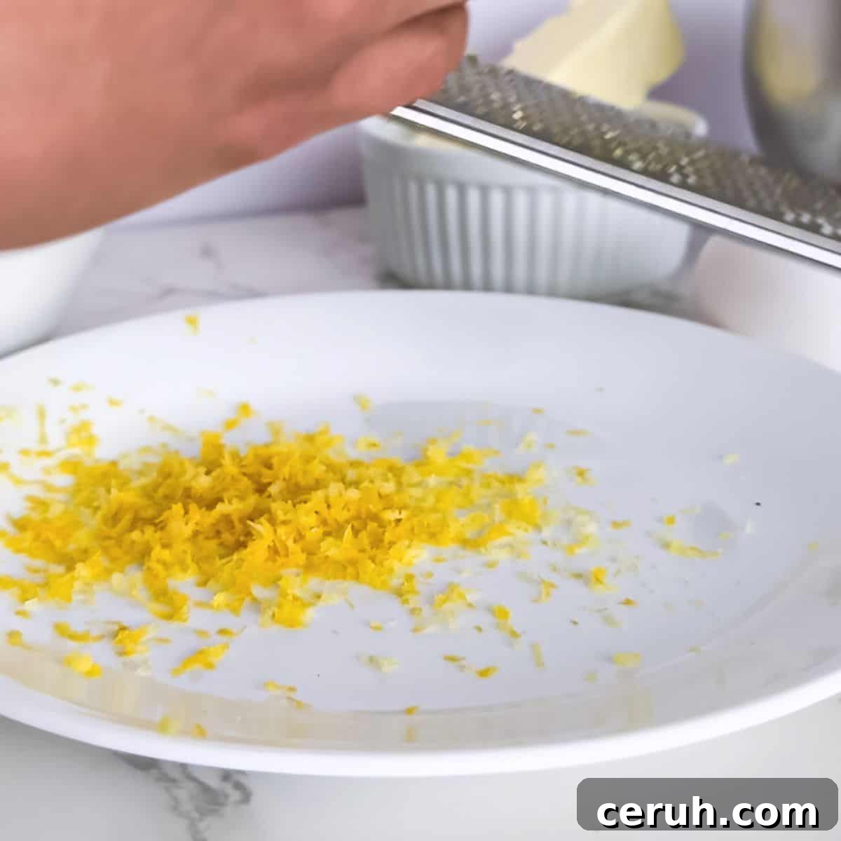 Microplaned lemon peel on a plate.