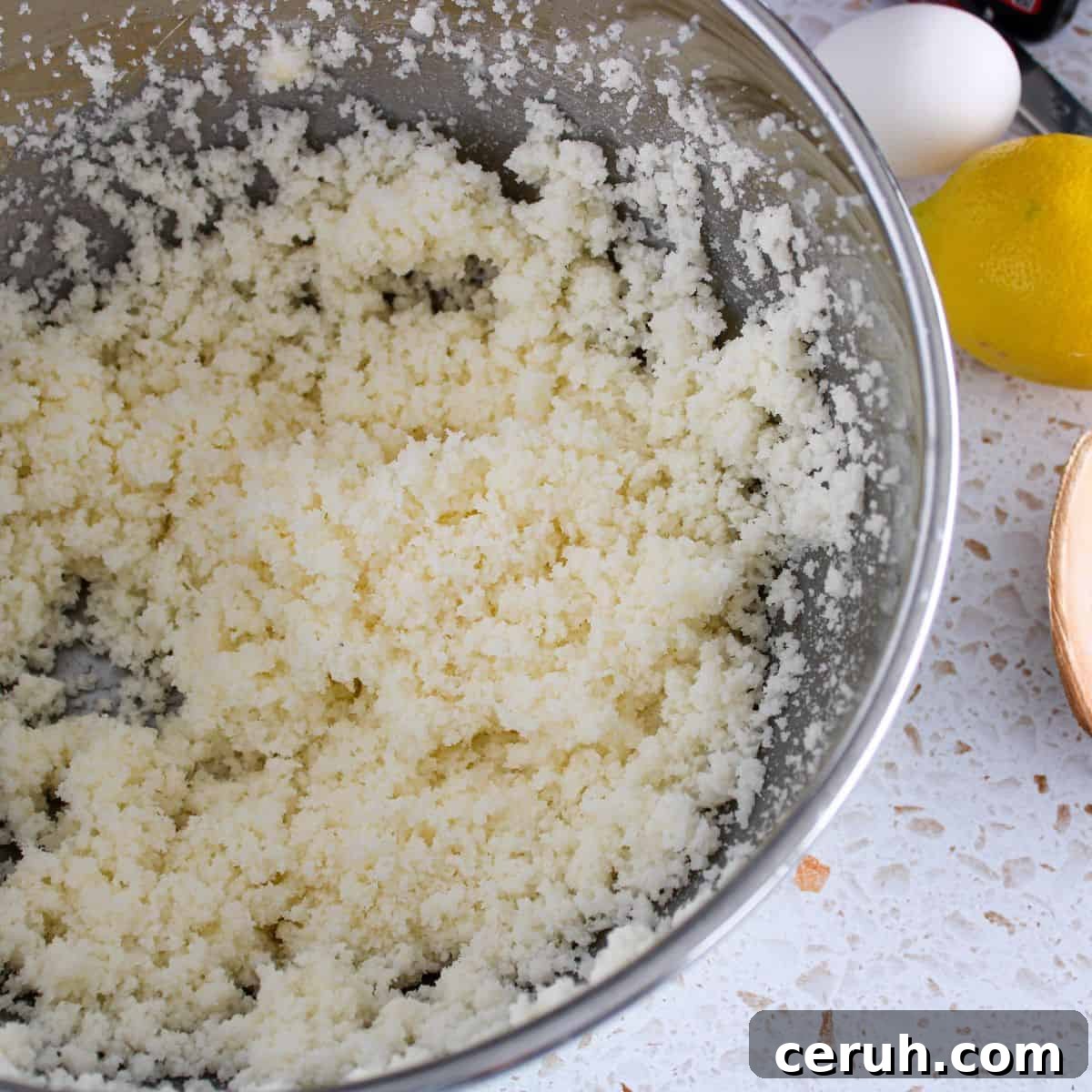 Creamed butter and sugar in a bowl.