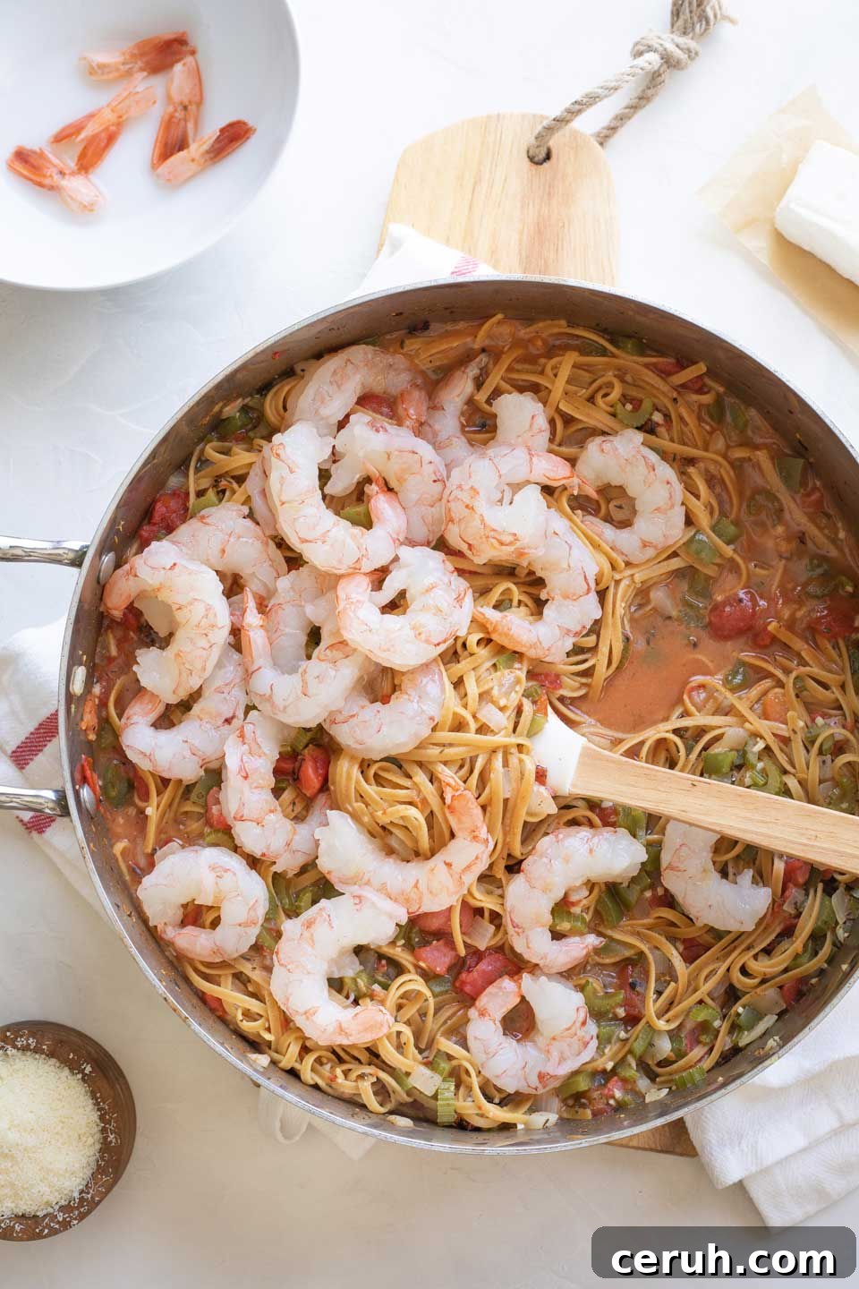 Raw shrimp added to pot.