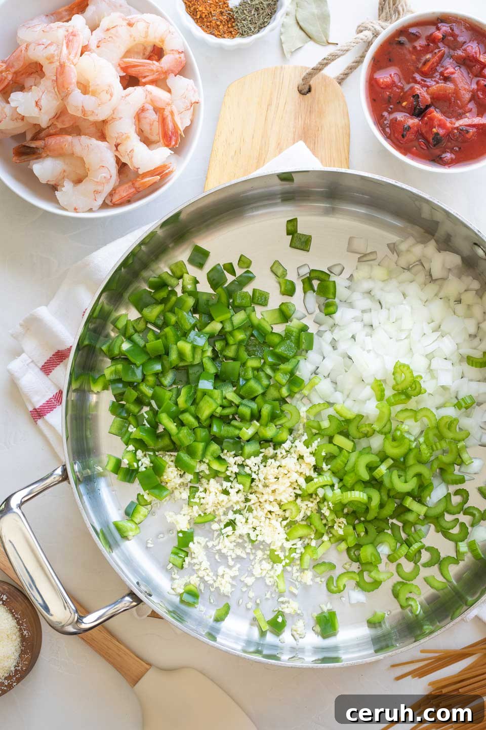 Overhead of raw vegetables just added to pot before cooking.