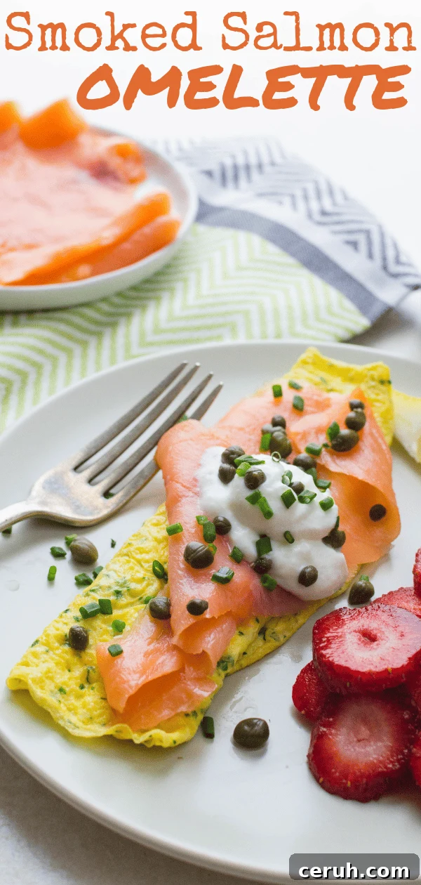 Quick, healthy & delish, this smoked salmon omelette is a great start to the day. An herb omelette embellished with buttery salmon, capers, chives & lemon. #omelette