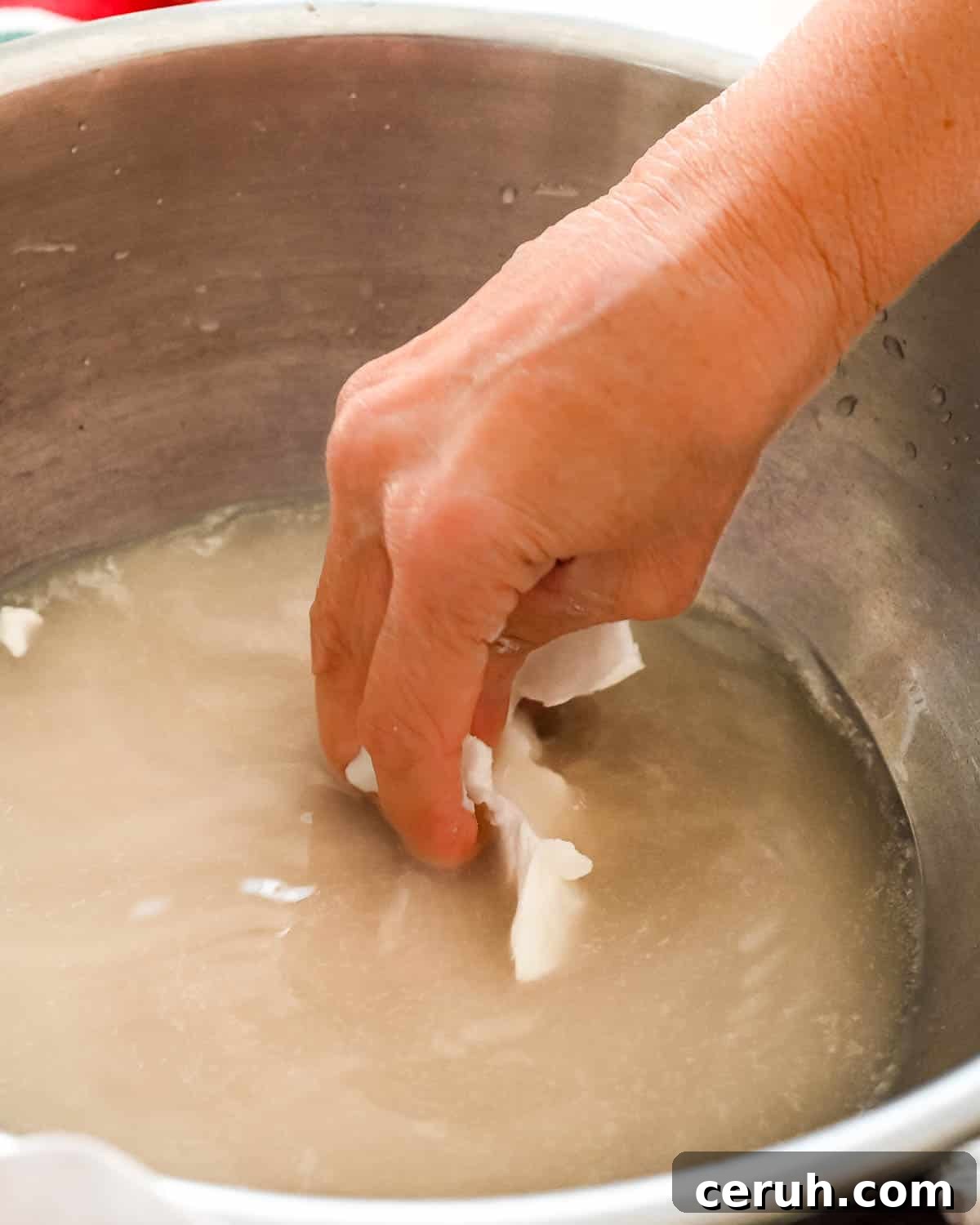 I am adding shortening to the yeast water and breaking it apart with fingers.