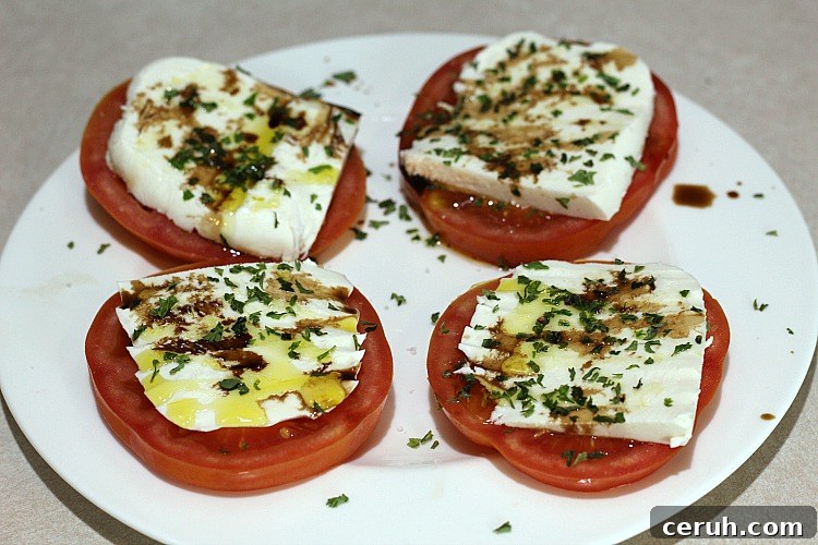 4 tomato Caprese Appetizer on a white plate