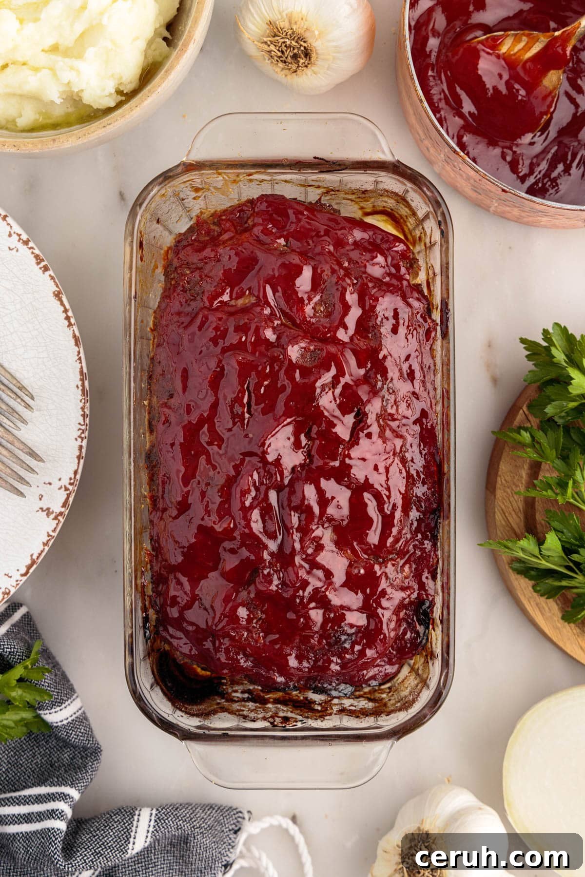 Overhead view of Lipton Onion Soup Meatloaf in a glass loaf pan after being baked.