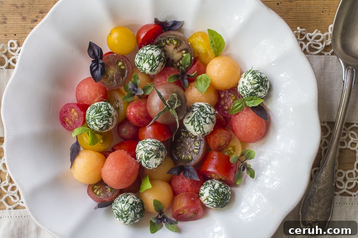 Heirloom Cherry Tomatoes, Summer Cantaloupe and Watermelon Balls, Goat Cheese Balls covered in Dill and Basil Sprigs complete the Salad