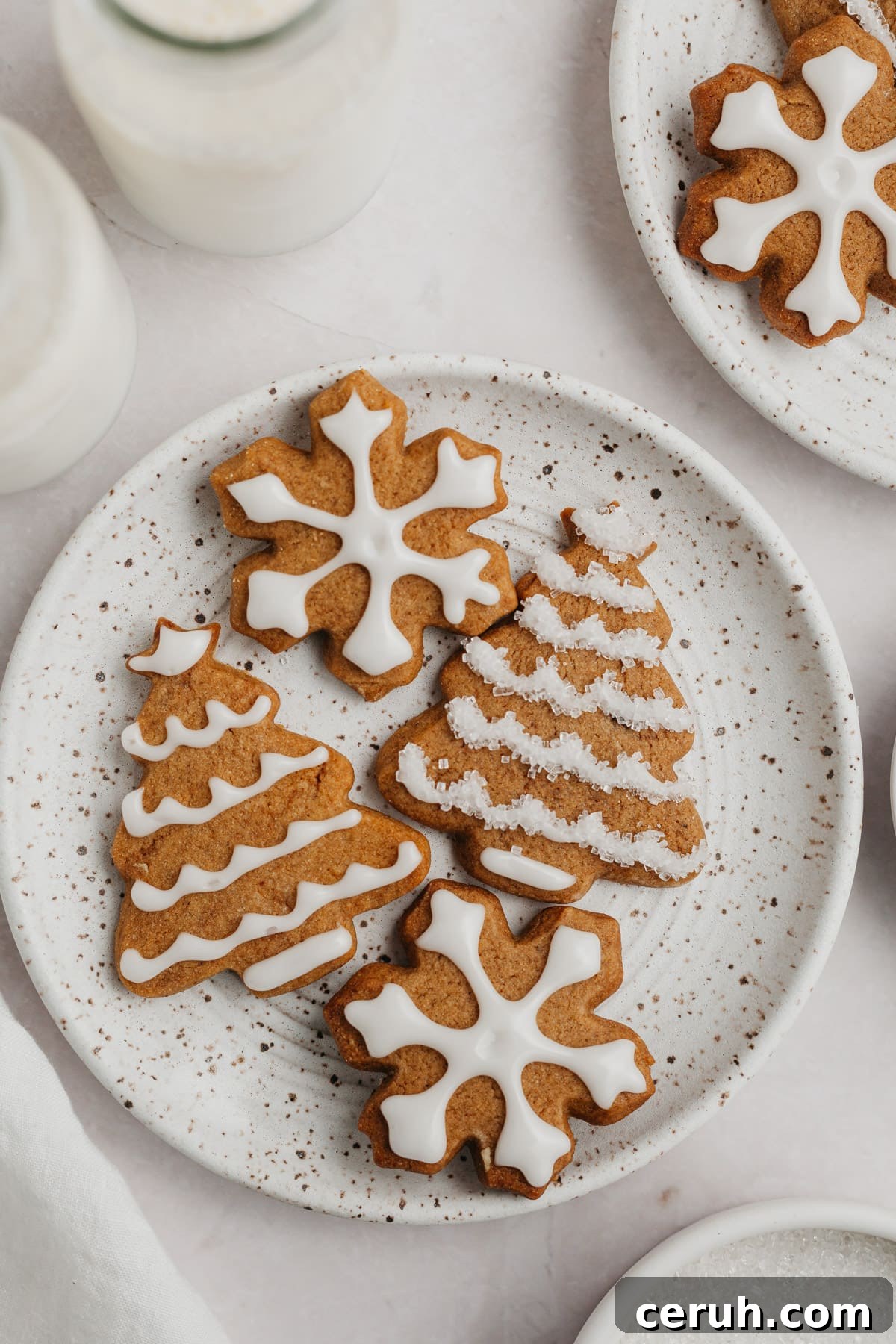 Iced gingerbread cookies on a plate.