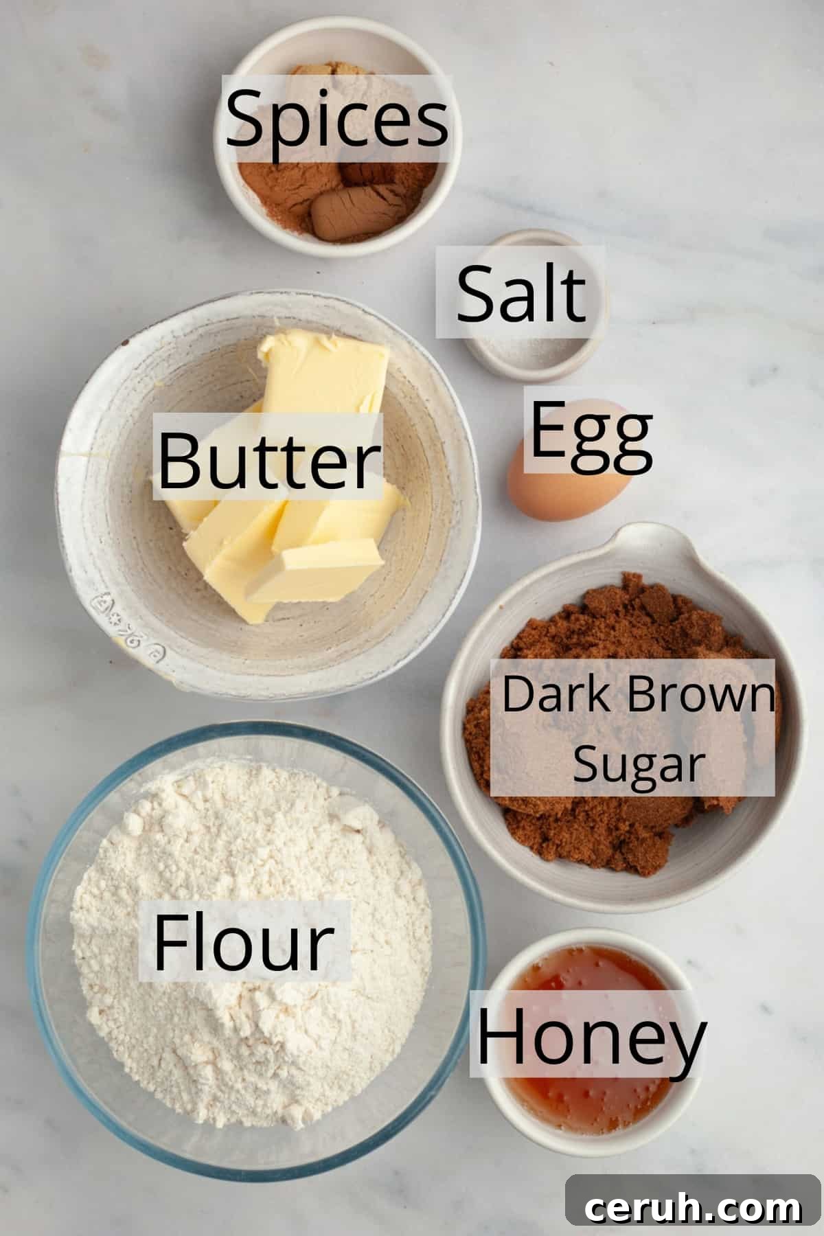 All the ingredients needed to make gingerbread cookies weighed out into small bowls.