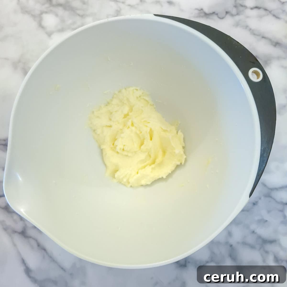 Orange Walnut Drizzle Cake with Zesty Citrus Glaze 5 Step 1, butter and sugar creamed together in a mixing bowl.