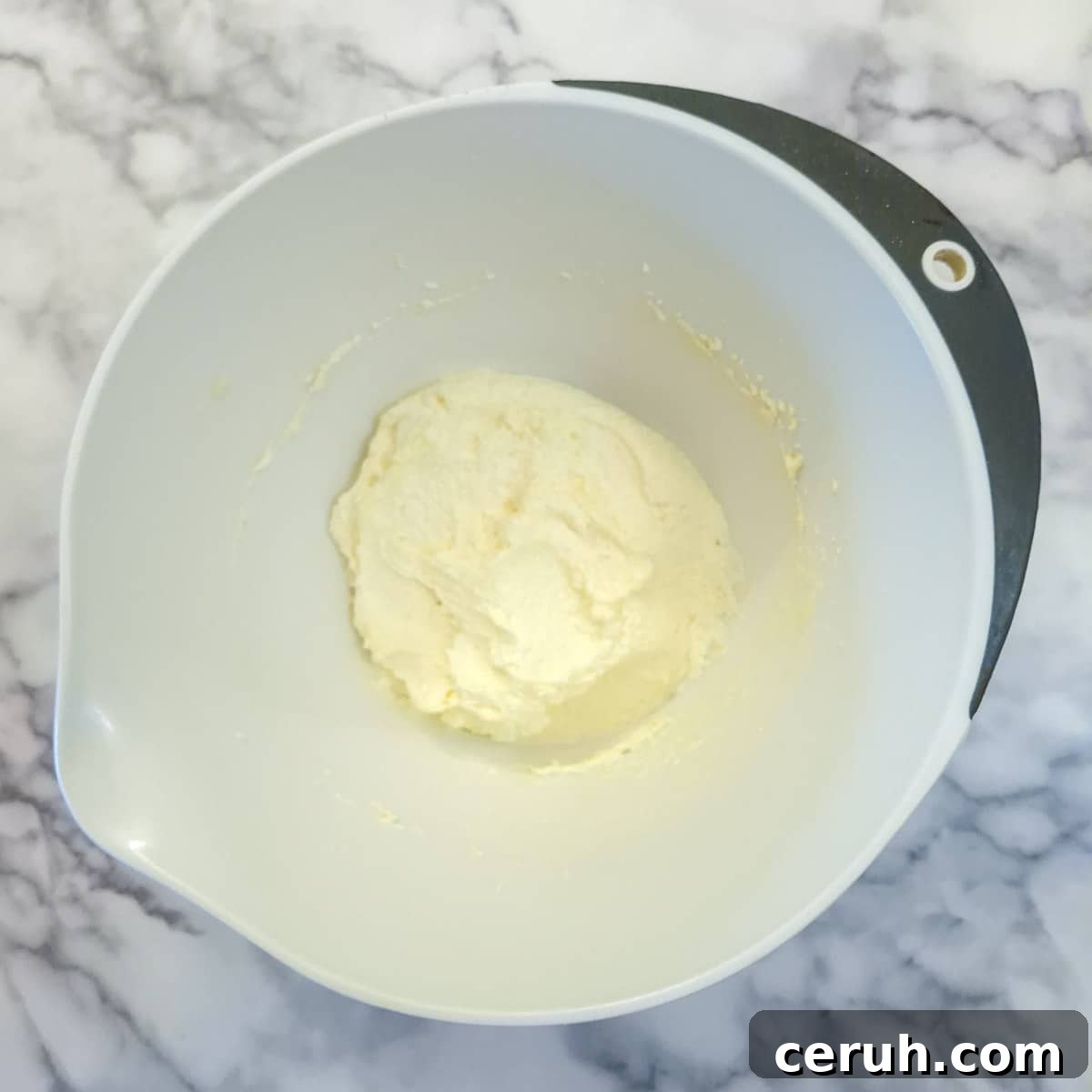 Orange Walnut Drizzle Cake with Zesty Citrus Glaze 6 Step 2, eggs beaten into the sugar and butter mixture.