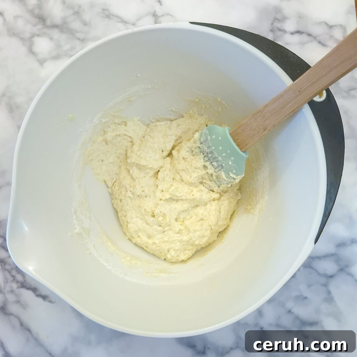 Orange Walnut Drizzle Cake with Zesty Citrus Glaze 7 Step 3, flour folded into the cake mixture.