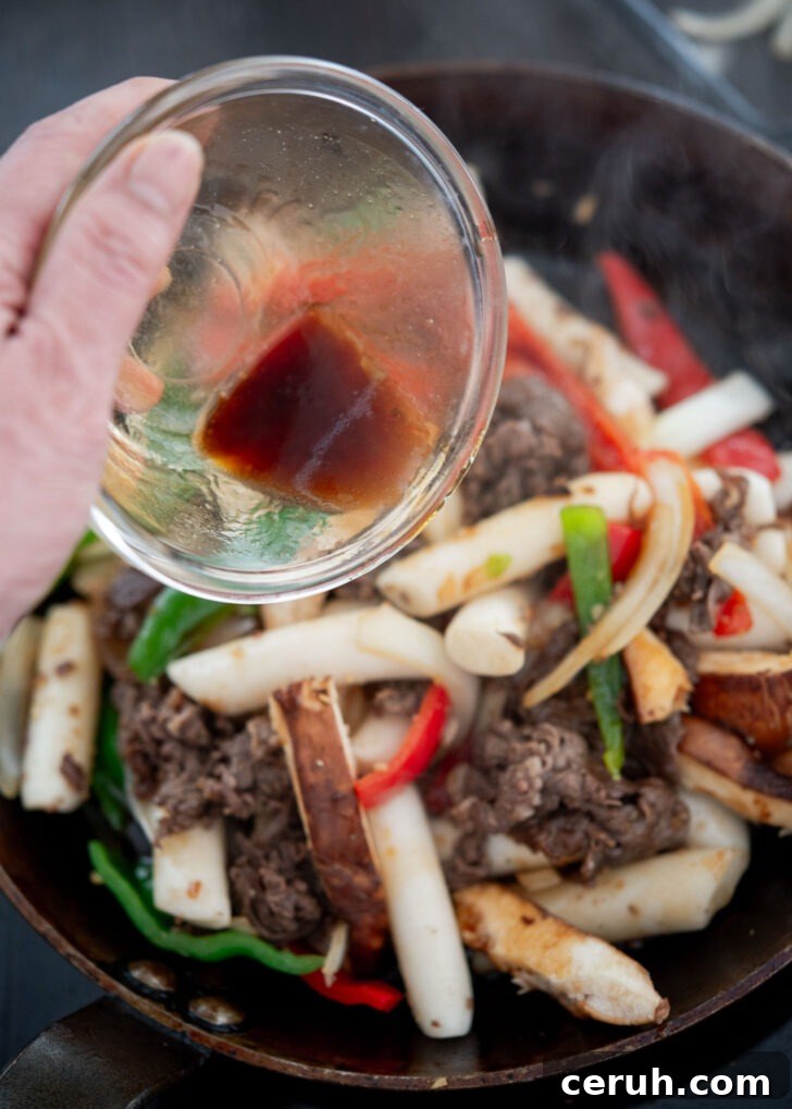 Non-spicy sauce mixture added to gungjung tteokbokki stir-fry.