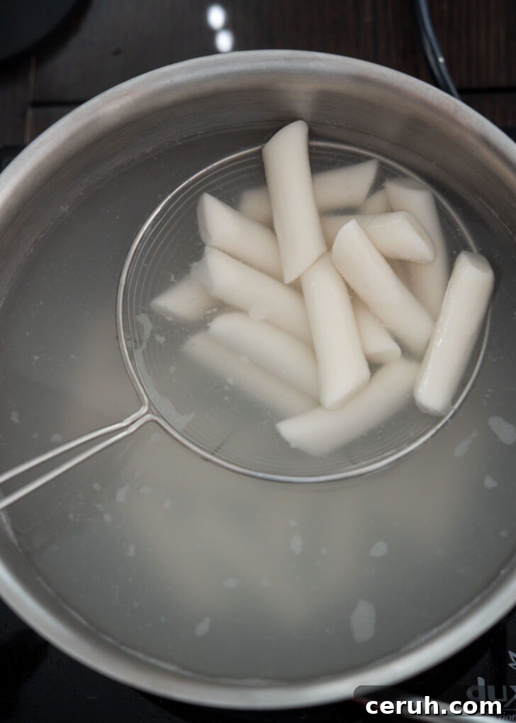 Cooking rice cakes in boiling water.