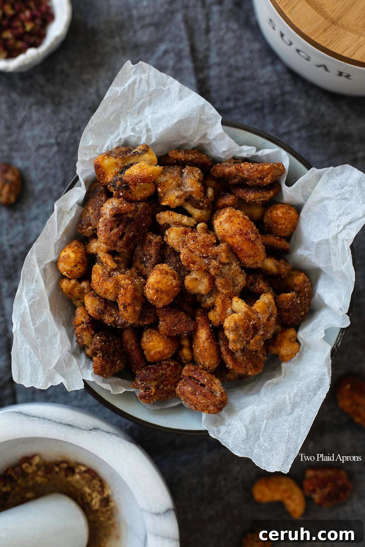 Top down view of spiced nuts in a bowl.