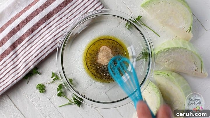 Mixing the seasoning with a whisk in a clear bowl