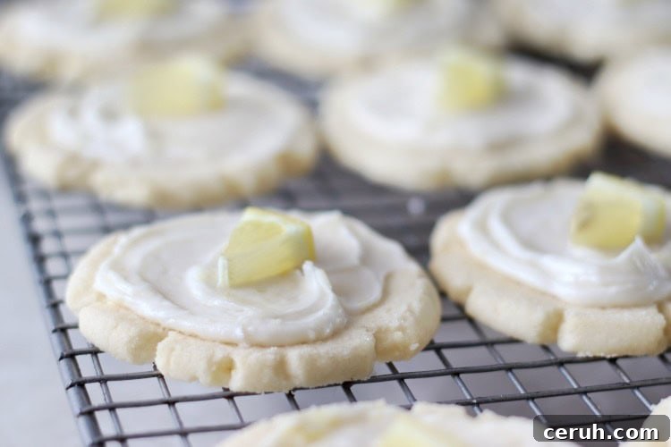 Lemon Sugar Cookies Recipe with Video Tutorial 3 frosted cookies on cooling rack