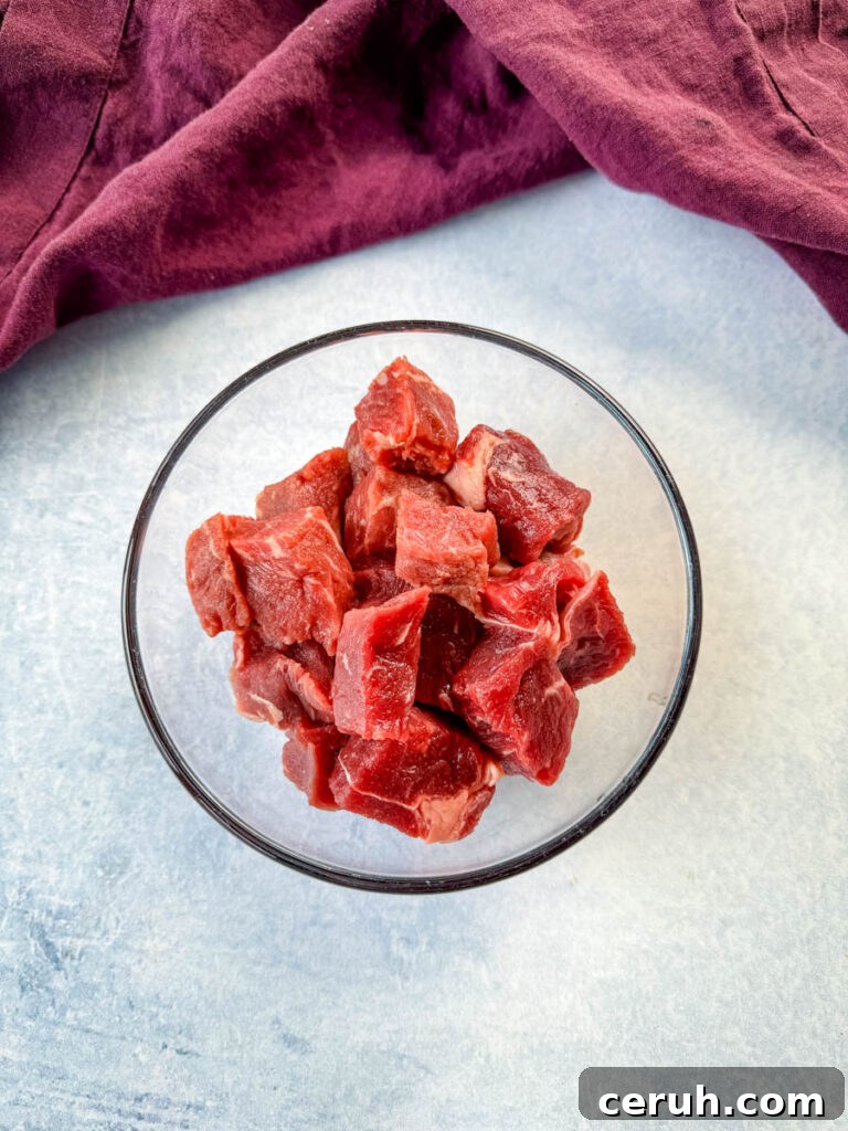 Hibachi Steak with Garlic Fried Rice Recipe 5 raw steak diced into pieces in a glass bowl