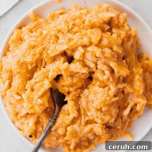A bowl of cheesy potatoes.